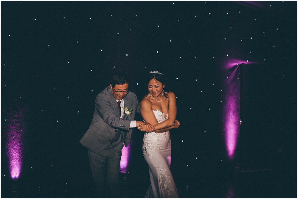 Bride dances with her dad at her wedding in Cheshire.