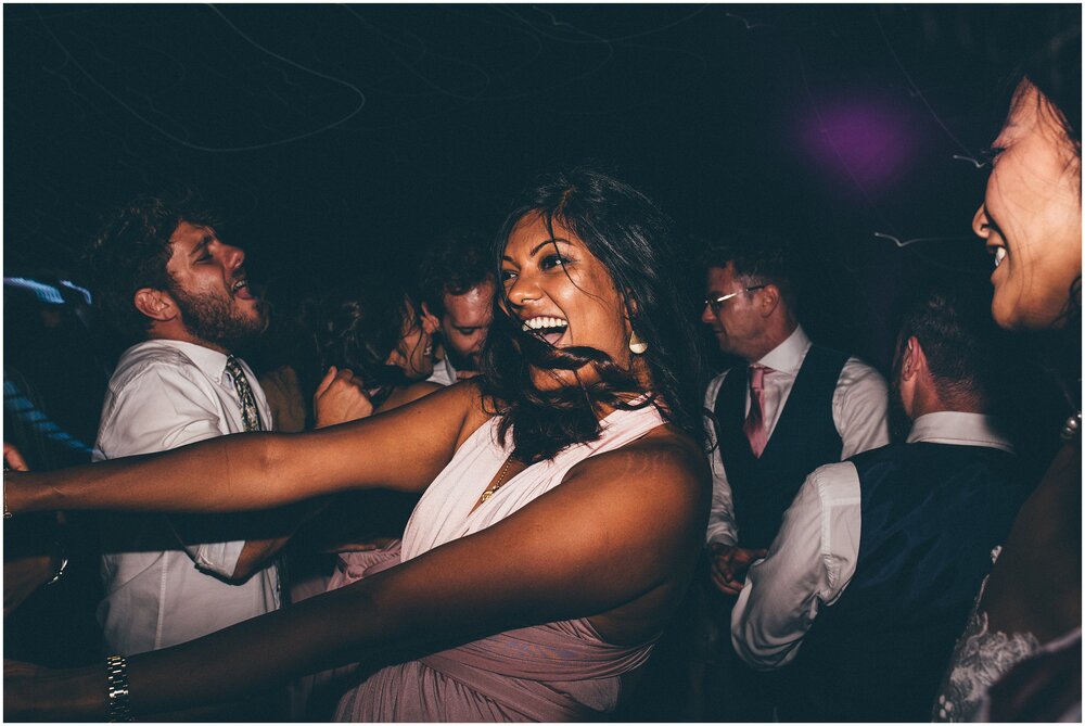 Wedding guests have a great time on the dance floor at Cheshire wedding.