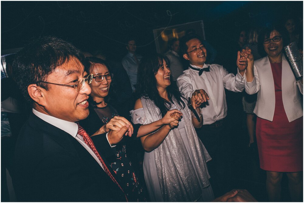 Wedding guests have a great time on the dance floor at Cheshire wedding.