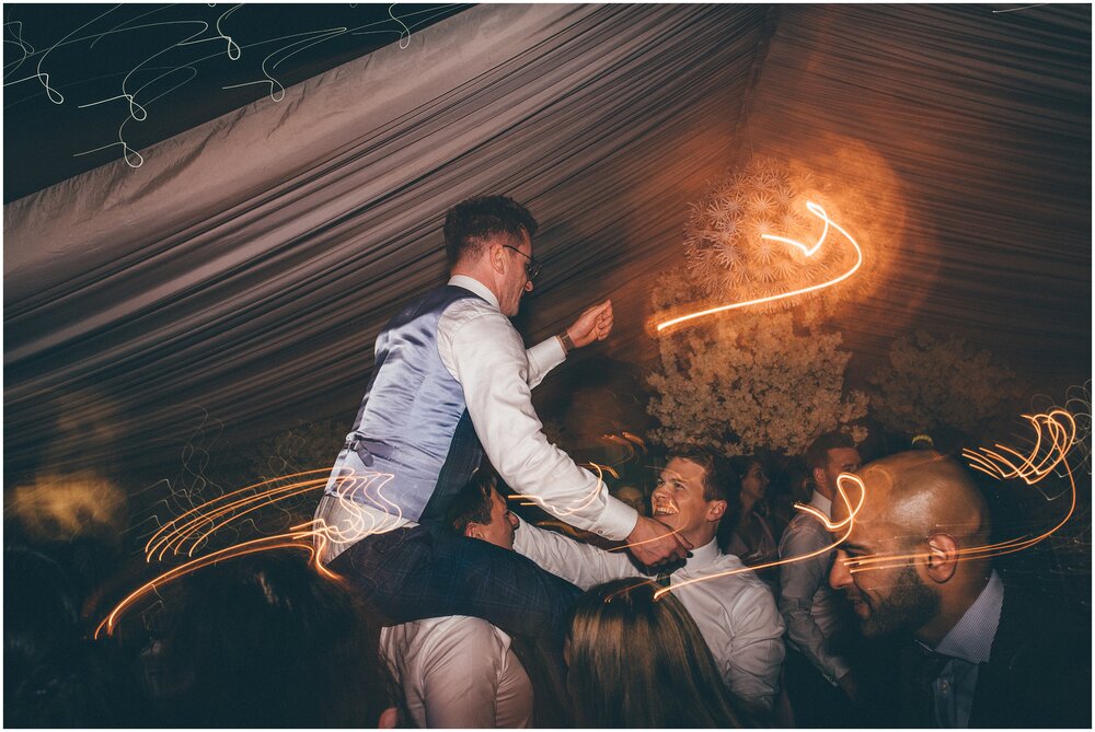 Wedding guests have a great time on the dance floor at Cheshire wedding.