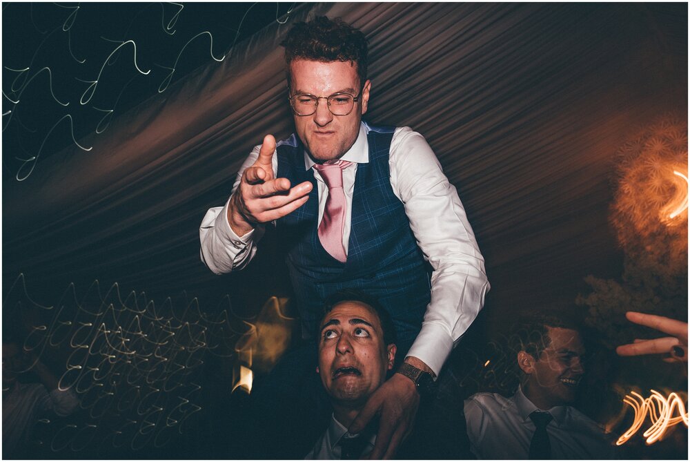 Wedding guests have a great time partying and dancing on the dance floor at Cheshire wedding.