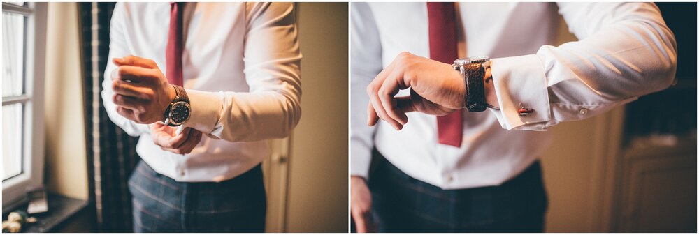 Groom fastens his watch and cufflinks ahead of his wedding.