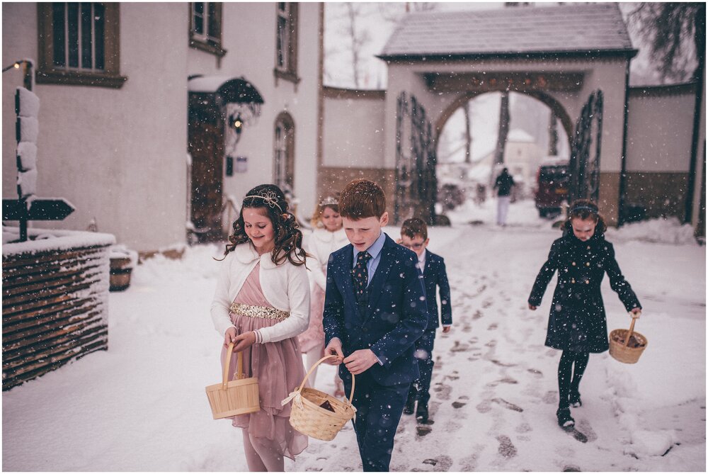 Walking to the wedding ceremony through the snow in Luxembourg.