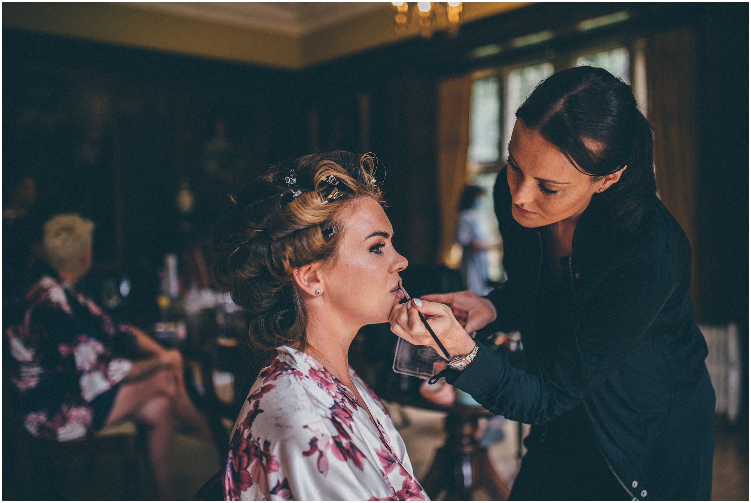 Bride has makeup applied my make up artist at wedding in Cheshire