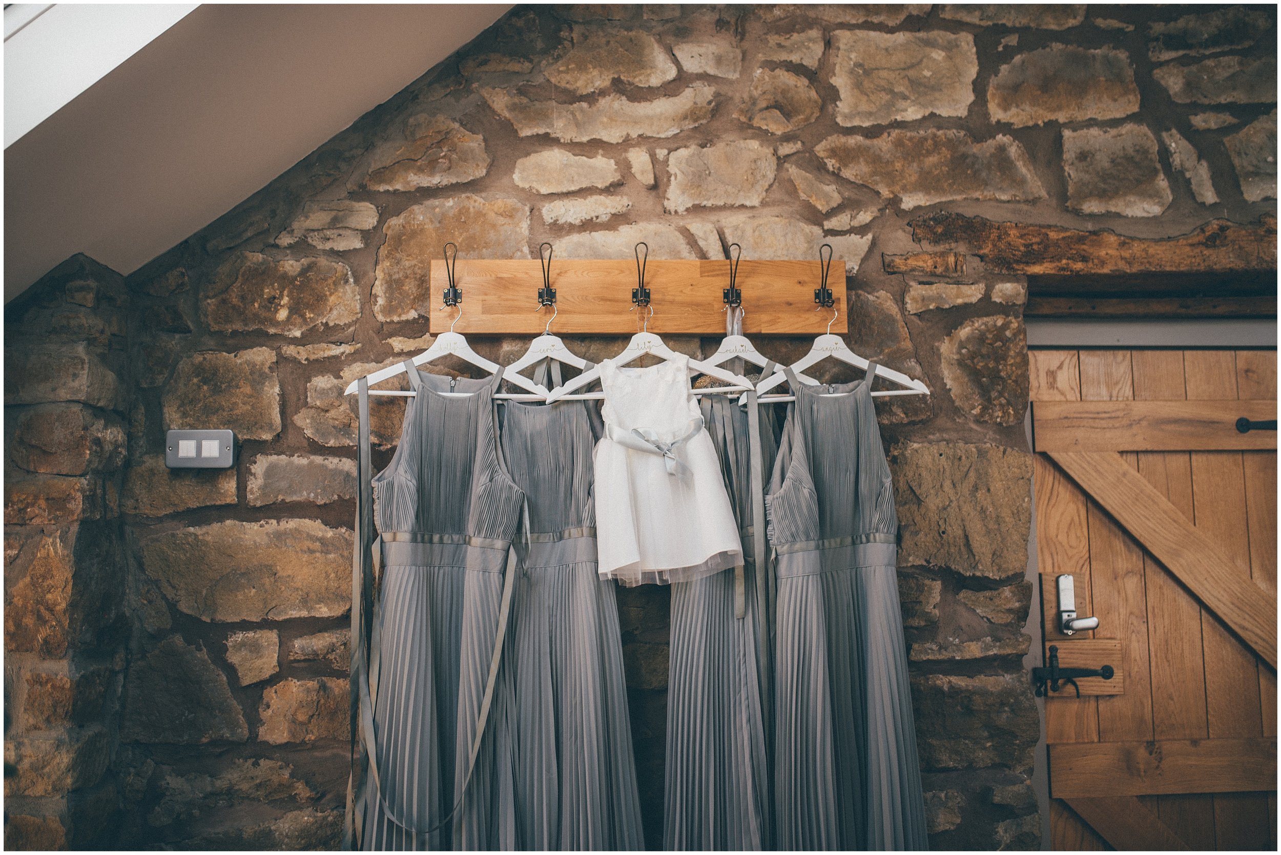 Bridesmaids dresses hung up at Tower Hill Barns in North Wales