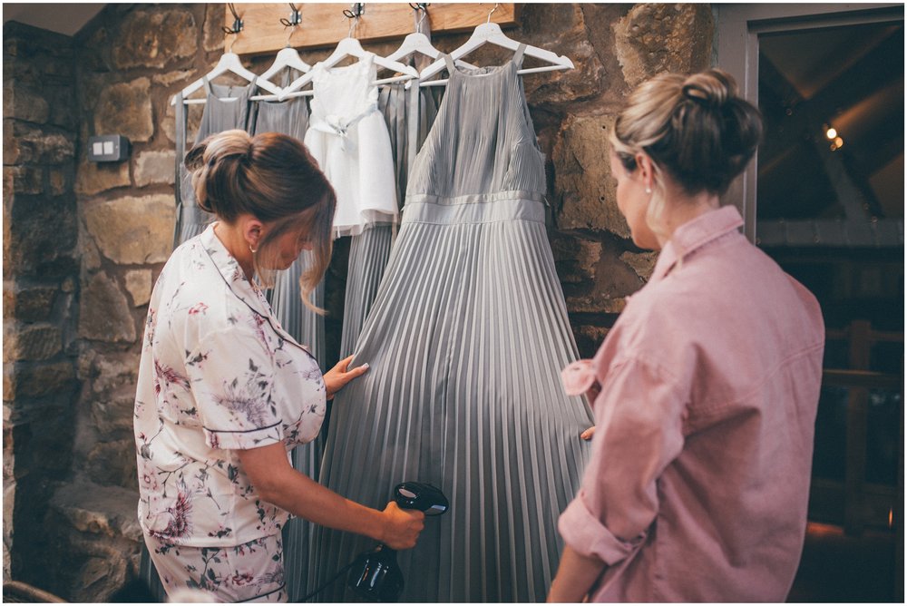 Bridesmaids steam dresses at Tower Hill Barns in North Wales