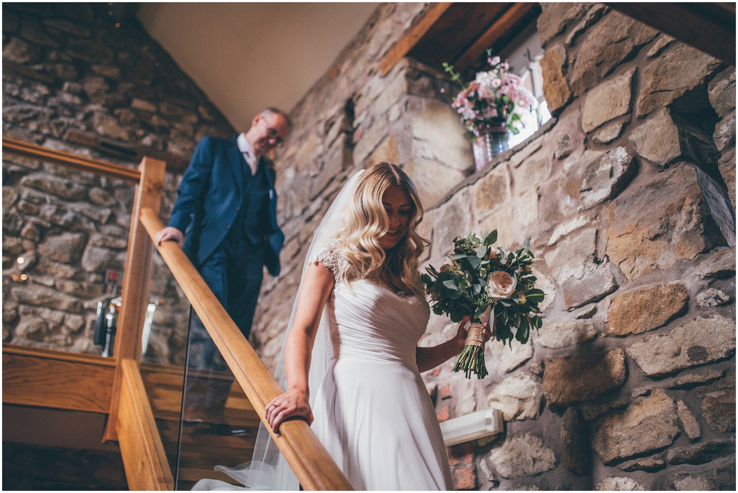 Bride walks to her ceremony at Tower Hill Barns in North Wales