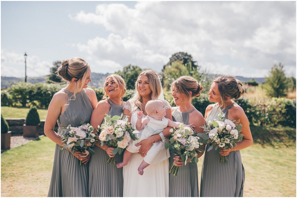 Bridesmaids in sage green dresses at Tower Hill Barns in North Wales