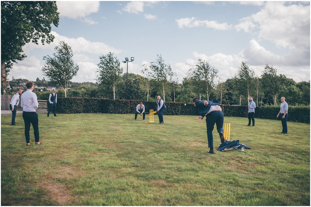 Wedding guests play cricket at Tower Hill Barns in North Wales