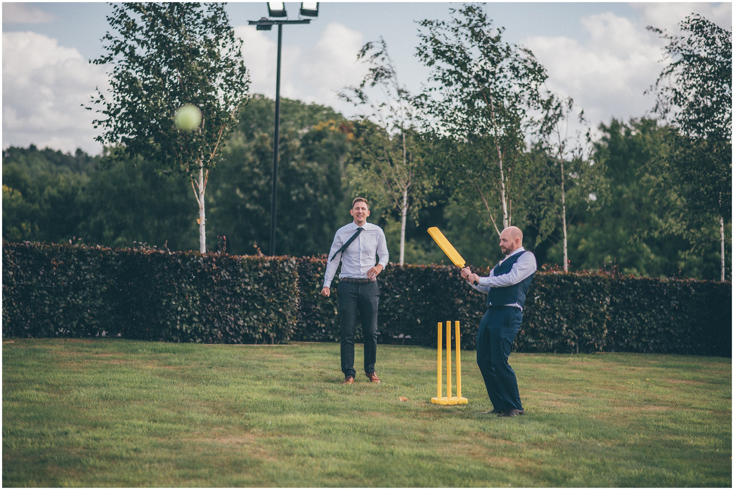 Wedding guests play cricket at Tower Hill Barns in North Wales