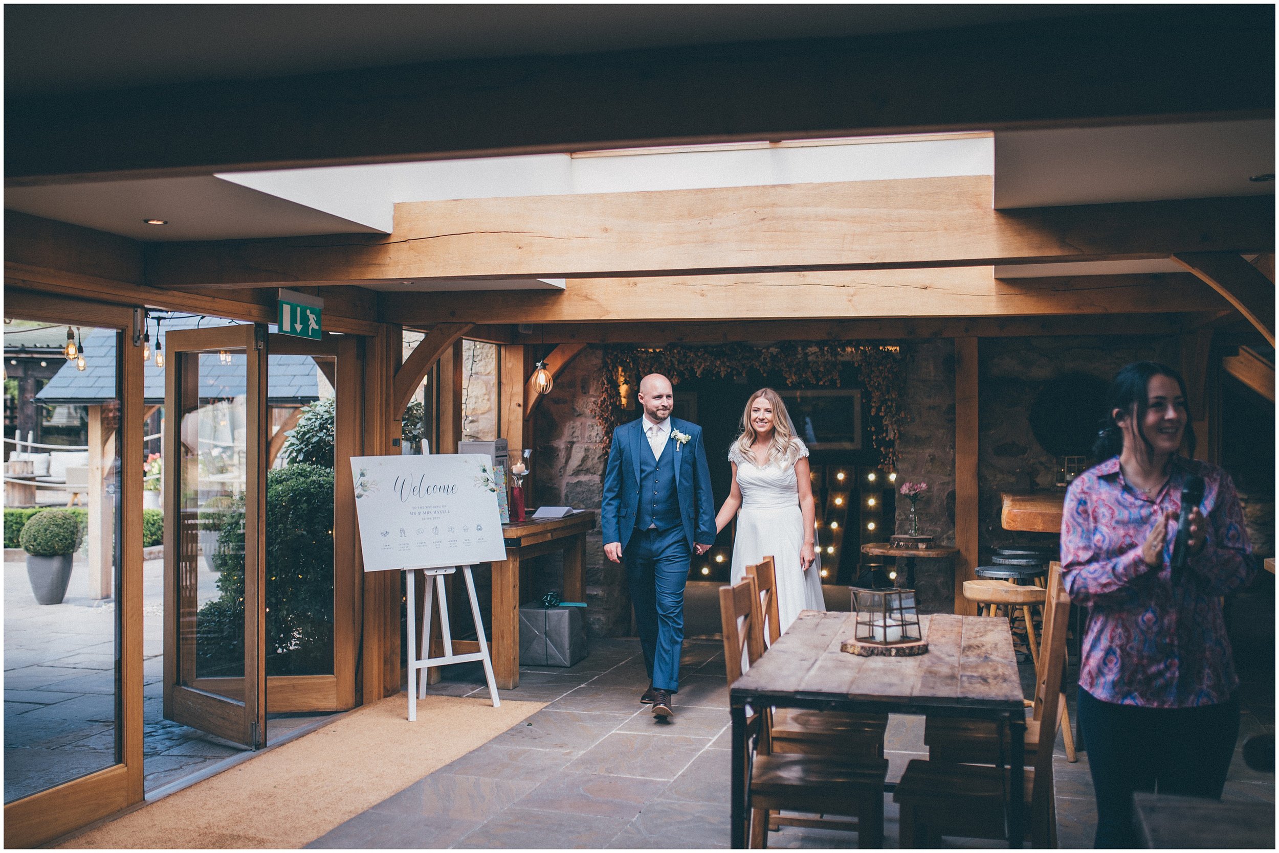 Bride and groom greet their guests at Tower Hill Barns