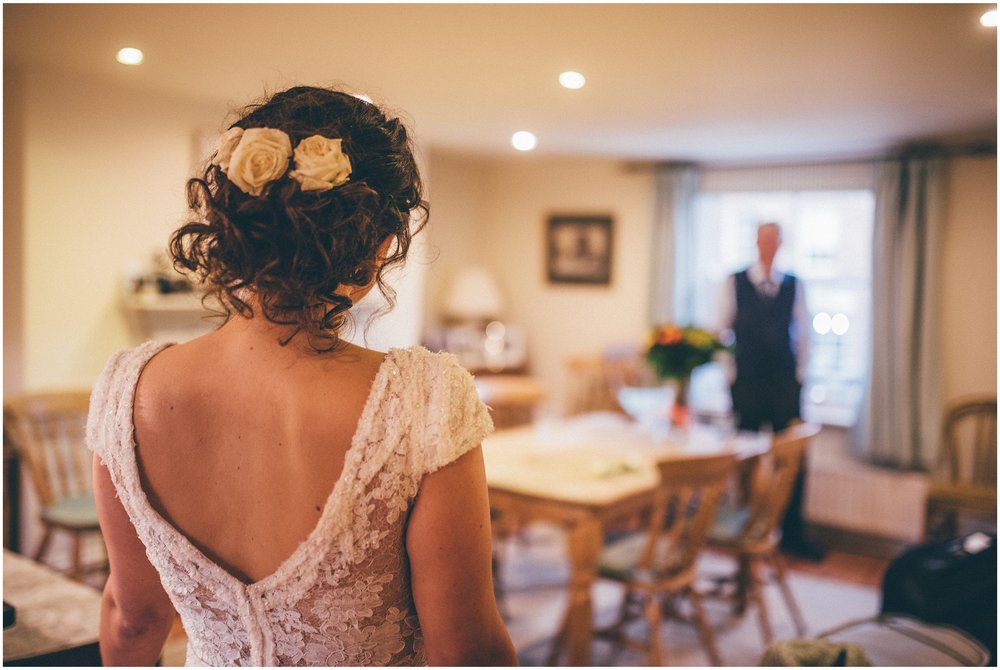 Father of the Bride sees his daughter in her dress for the first time