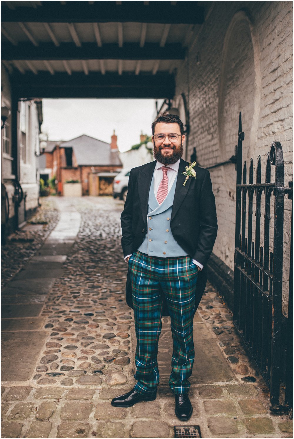 Groom wears tartan trousers on his wedding day at Grange Barn, Cheshire
