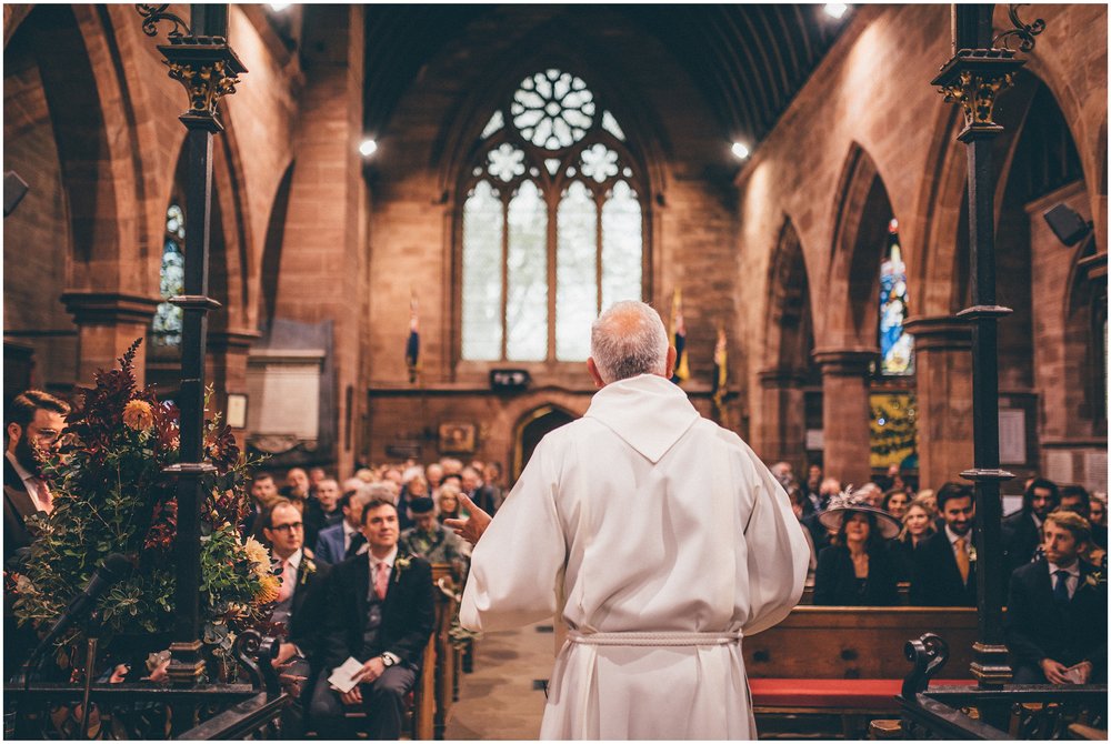 Vicar greets congregation at Cheshire wedding