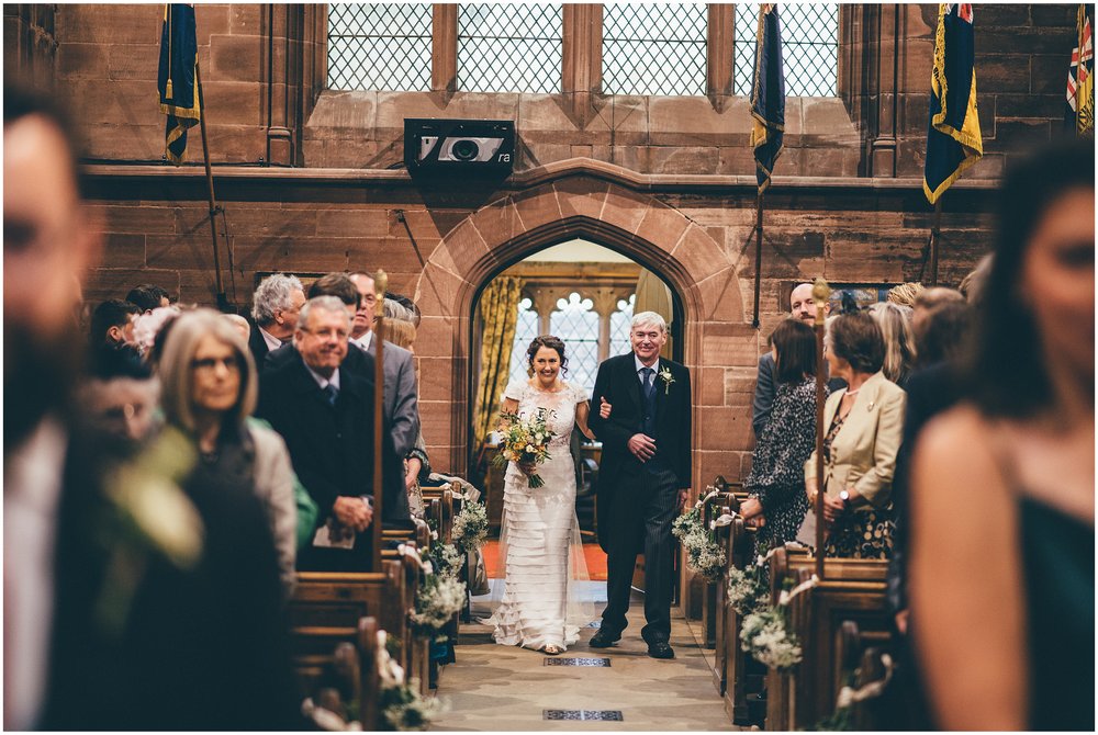 Bride walks down the aisle with her dad at Cheshire wedding