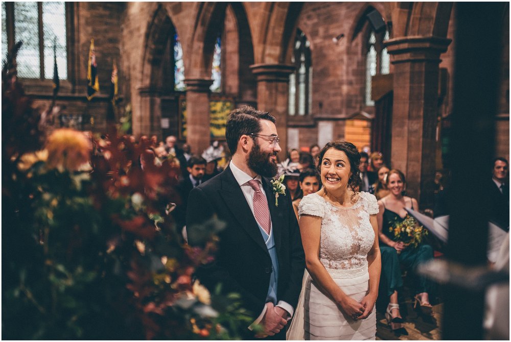 Bride and groom meet at the alter for their wedding ceremony in Tarporley, Cheshire