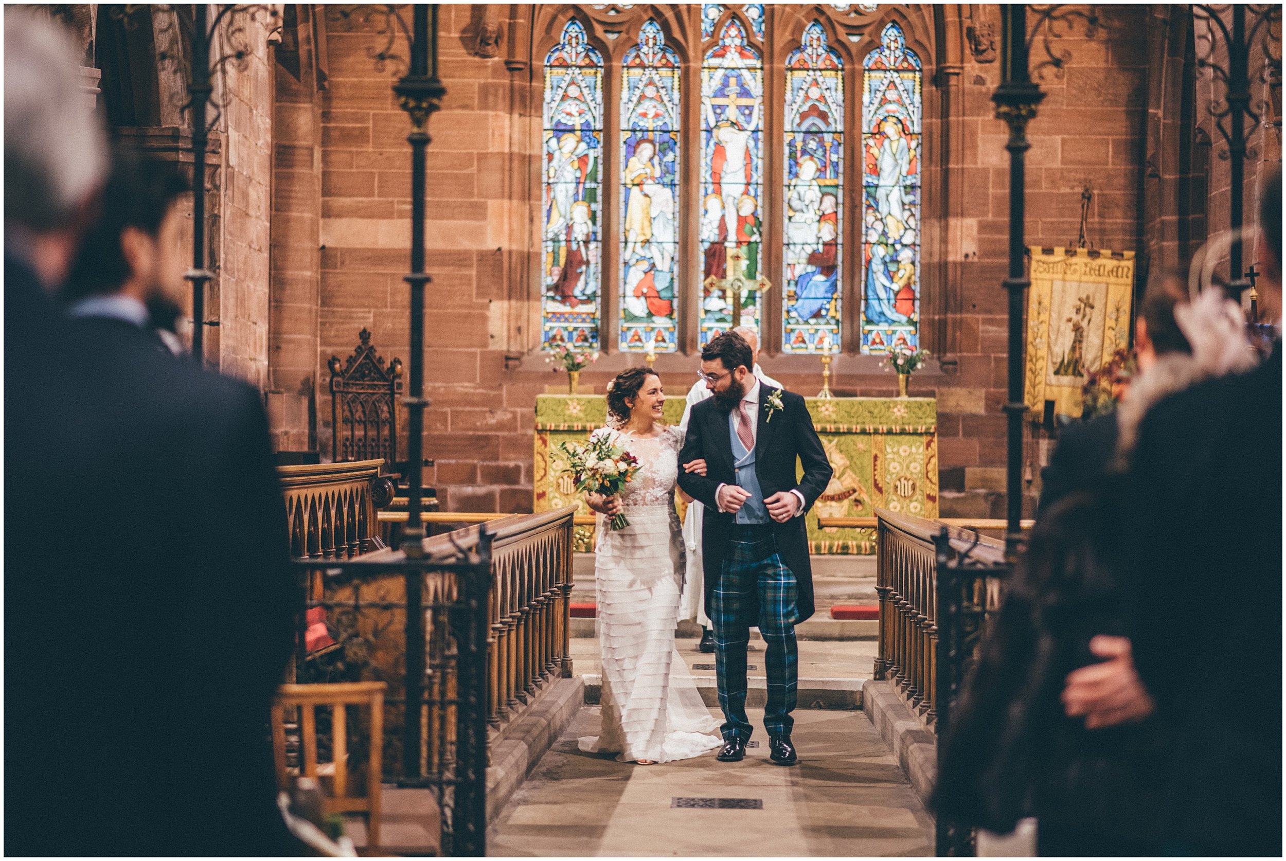 New husband and wife walk down the aisle in Cheshire