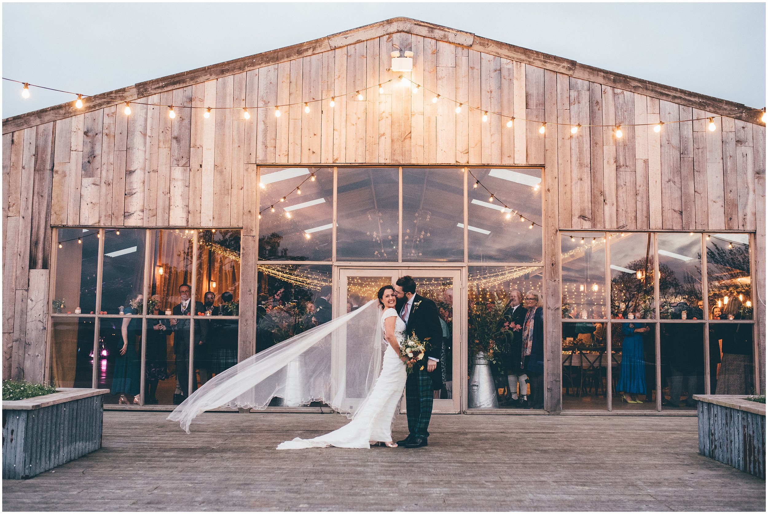 Bride and groom outside during twilight hour at Grange Barn wedding venue in Cheshire 