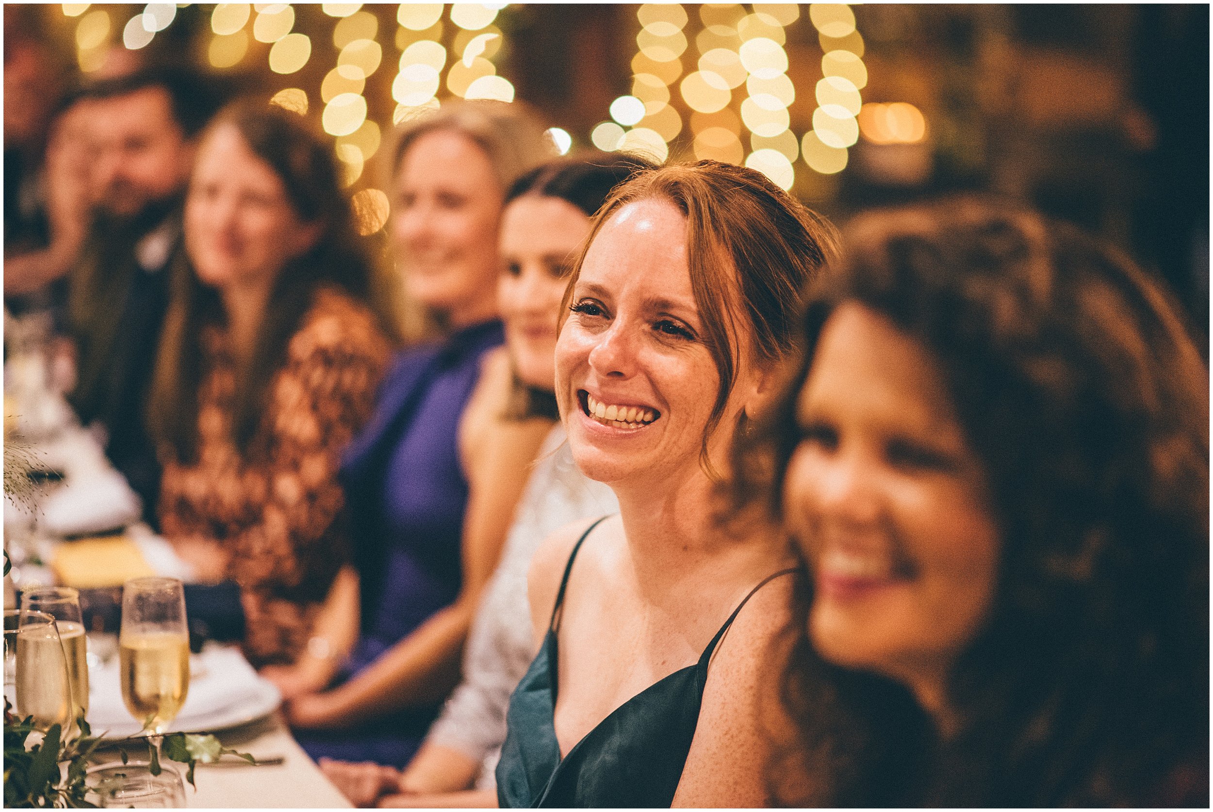 Wedding speeches take place in the main room at Grange Barn in Cheshire