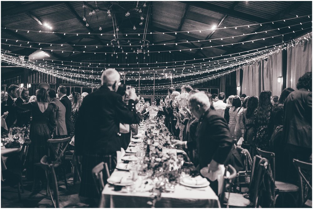 Wedding speeches take place in the main room at Grange Barn in Cheshire