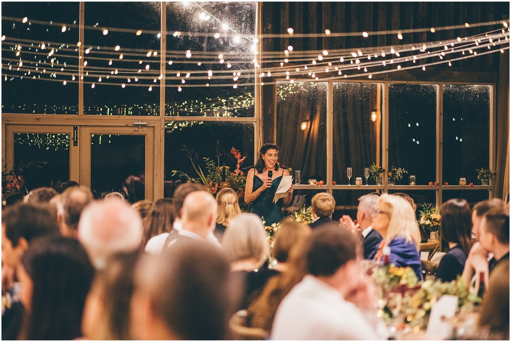 Wedding speeches take place in the main room at Grange Barn in Cheshire