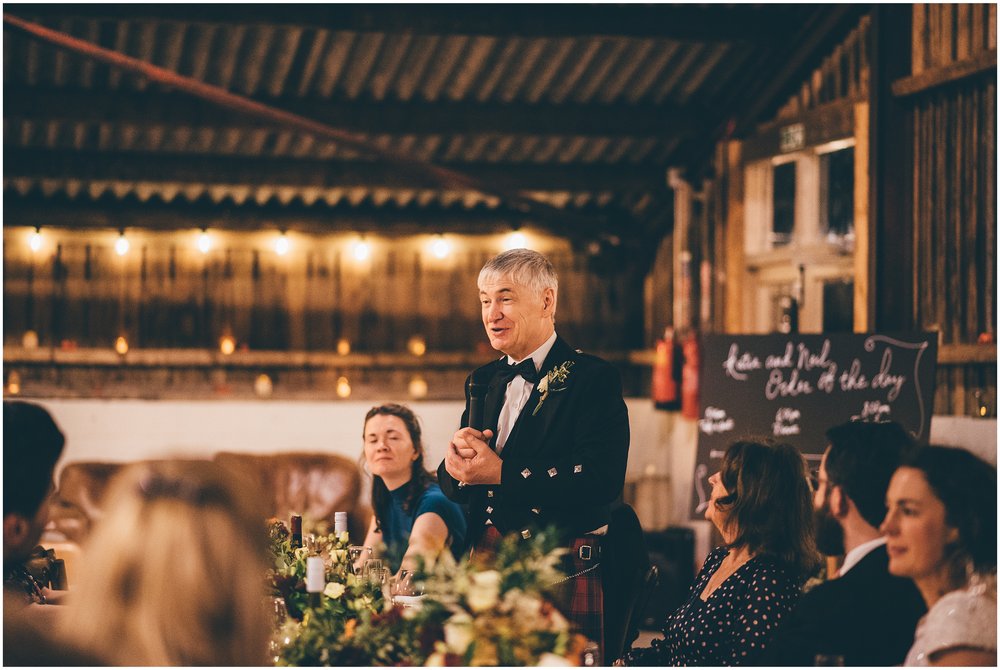 Wedding speeches take place in the main room at Grange Barn in Cheshire