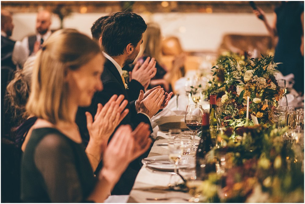 Wedding speeches take place in the main room at Grange Barn in Cheshire