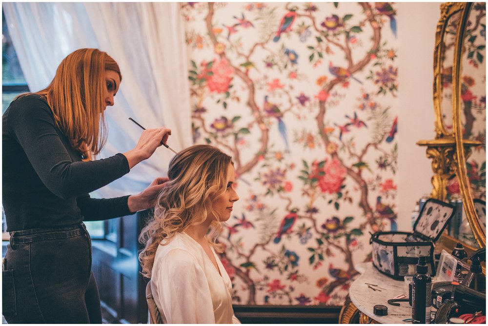 Bride gets her hair done on wedding morning at Tyn Dwr Hall