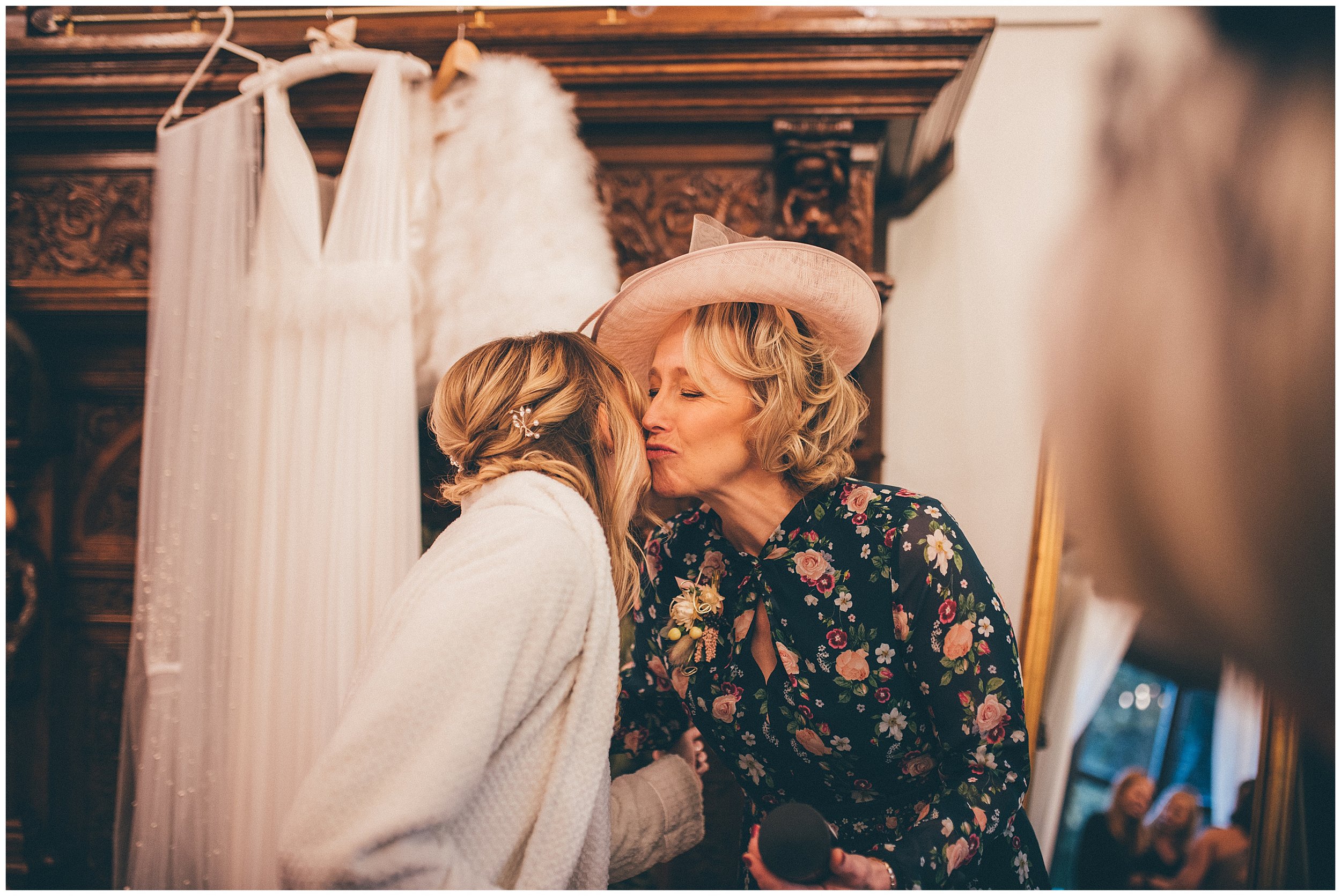 Bride kisses her mum before her wedding at Tyn Dwr Hall
