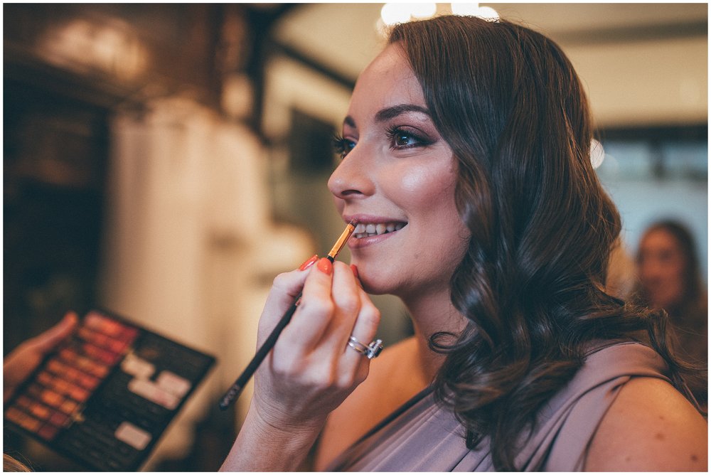 Bridesmaid gets her make-up done on wedding morning at Tyn Dwr Hall