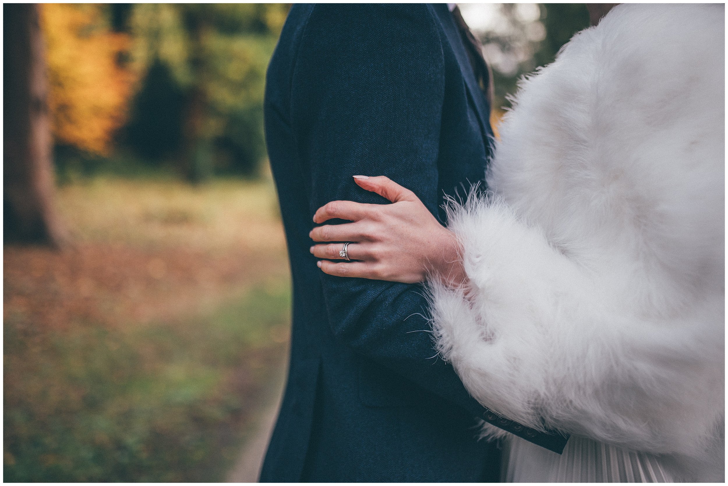 Newlyweds walk around their wedding venue, Tyn Dwr Hall, having photographs taken but their Cheshire wedding photographer