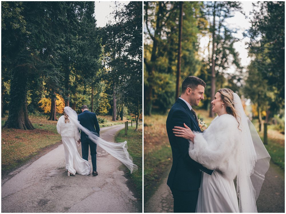 Newlyweds walk around their wedding venue, Tyn Dwr Hall, having photographs taken but their Cheshire wedding photographer