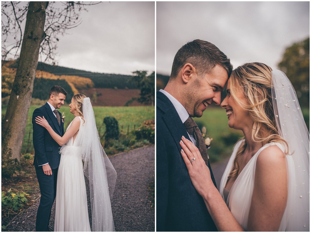 Newlyweds walk around their wedding venue, Tyn Dwr Hall, having photographs taken but their Cheshire wedding photographer