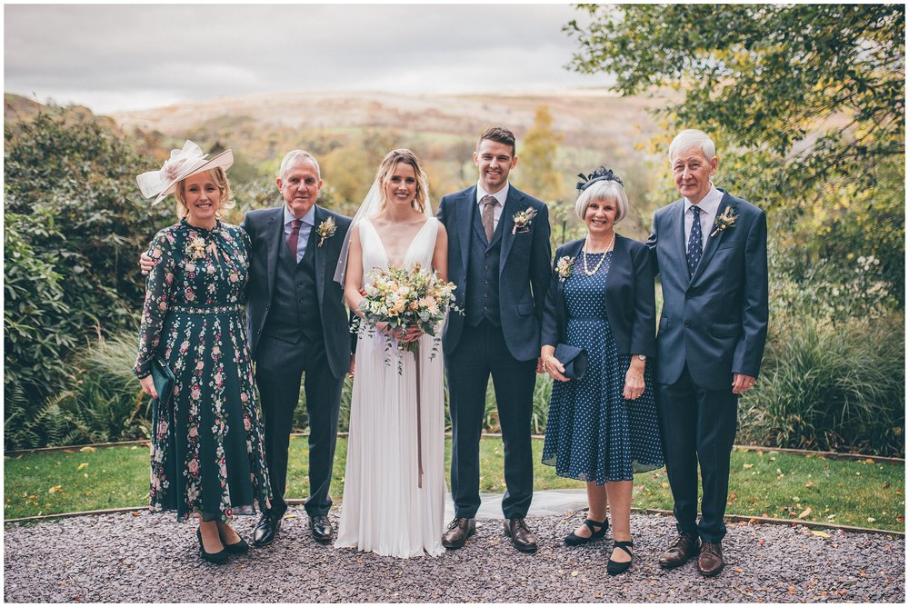 Bride and groom with their parents at Tyn Dwr Hall wedding