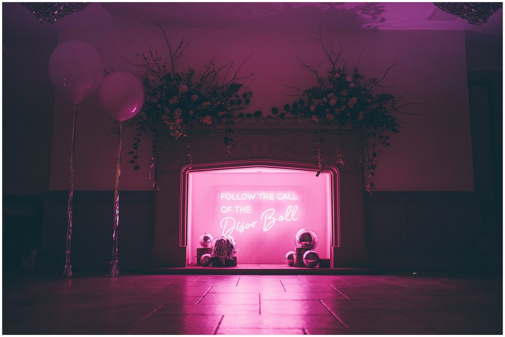 Wedding party with disco balls an neon lights at Tyn Dwr Hall, North Wales