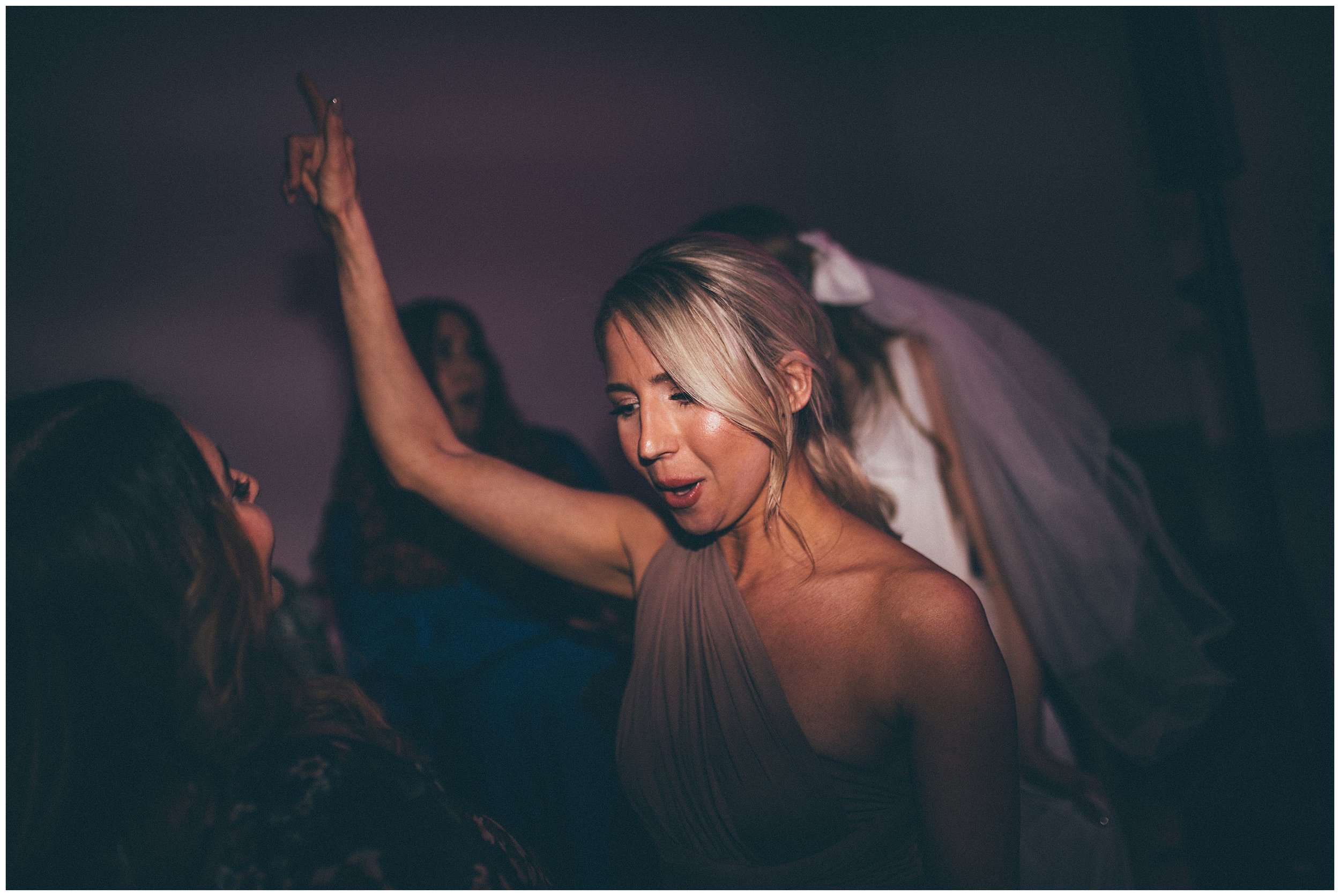 Wedding guests dance during the party at Tyn Dwr Hall