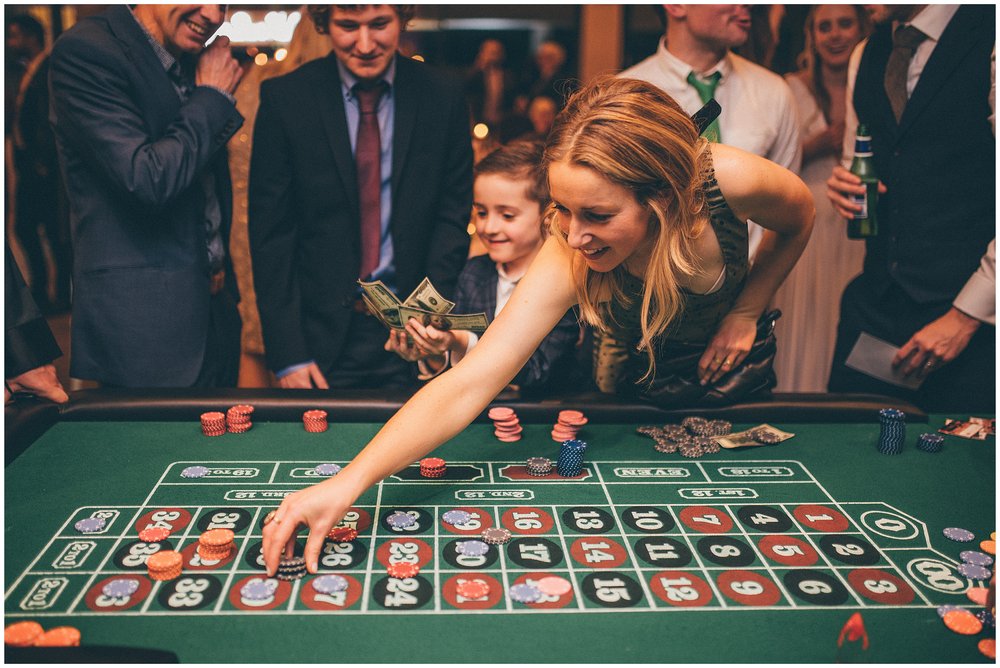 Guests enjoy Poker Table and roulette table at Tyn Dwr Hall wedding
