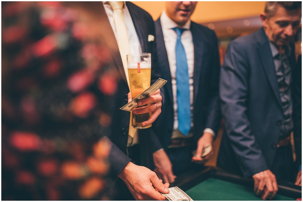 Guests enjoy Poker Table and roulette table at Tyn Dwr Hall wedding