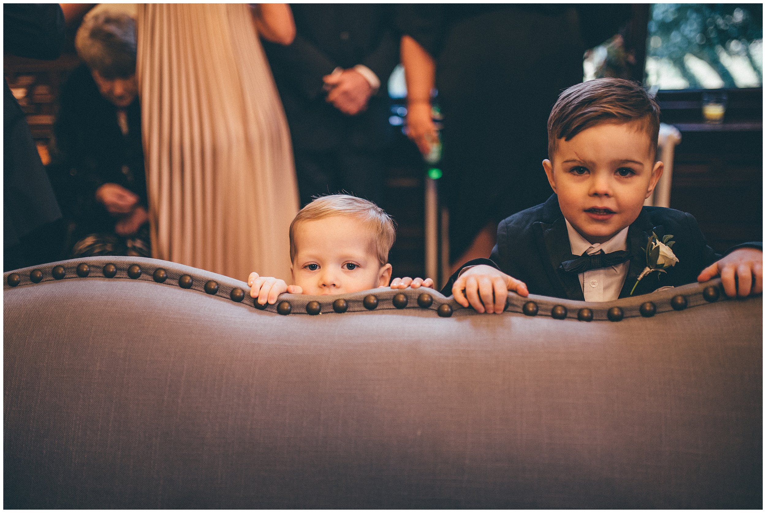 Children peep over the sofa at Tyn Dwr Hall wedding