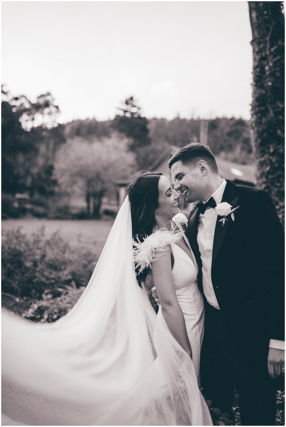 Bride and groom share a romantic moment at Tyn Dwr Hall