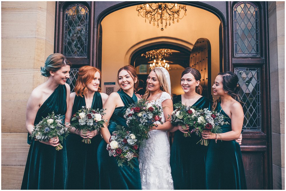 Bride laughs with her bridesmaids at Tyn Dwr Hall wedding