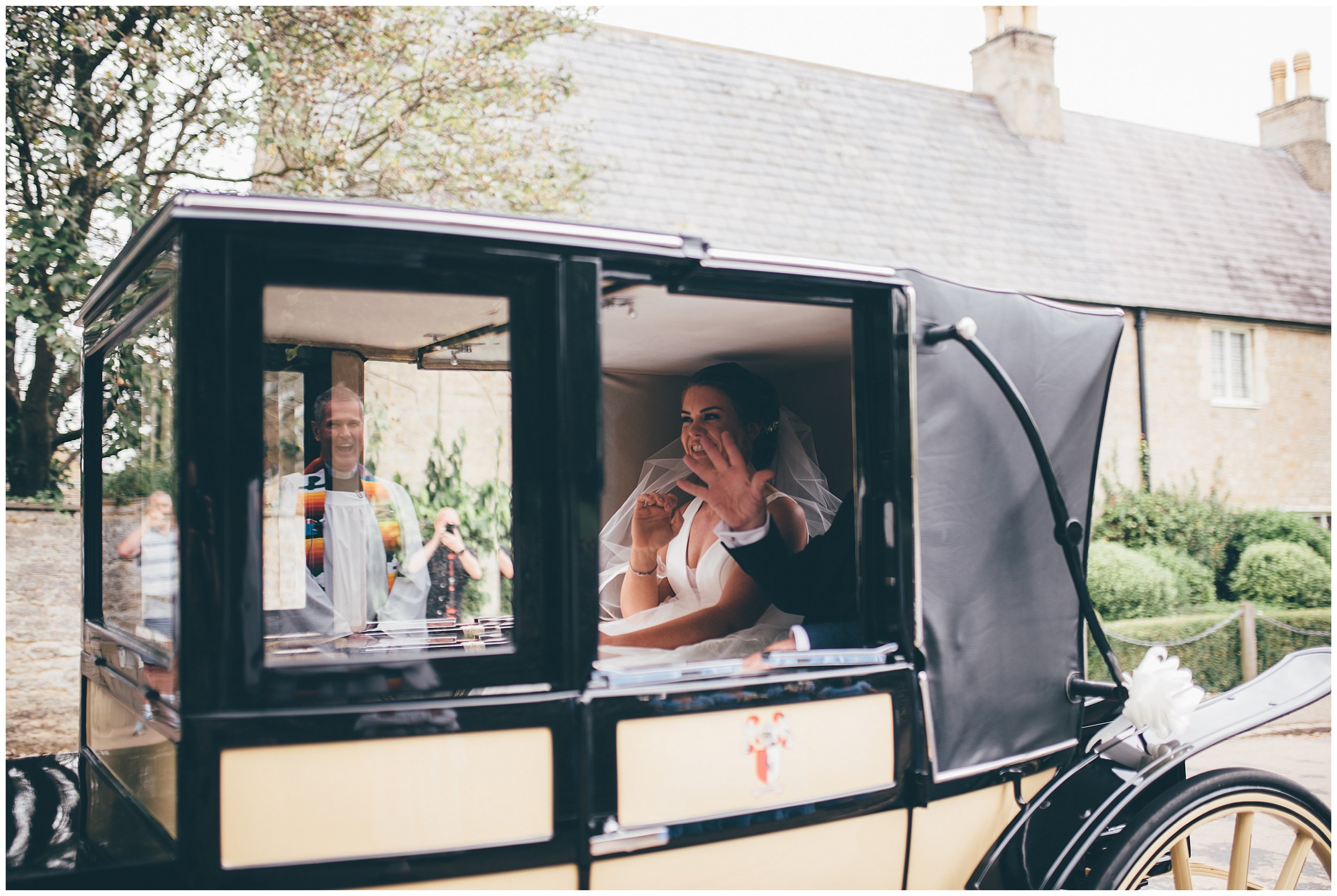 Reflection of the vicar in the car as the bride arrives to her Cheshire wedding