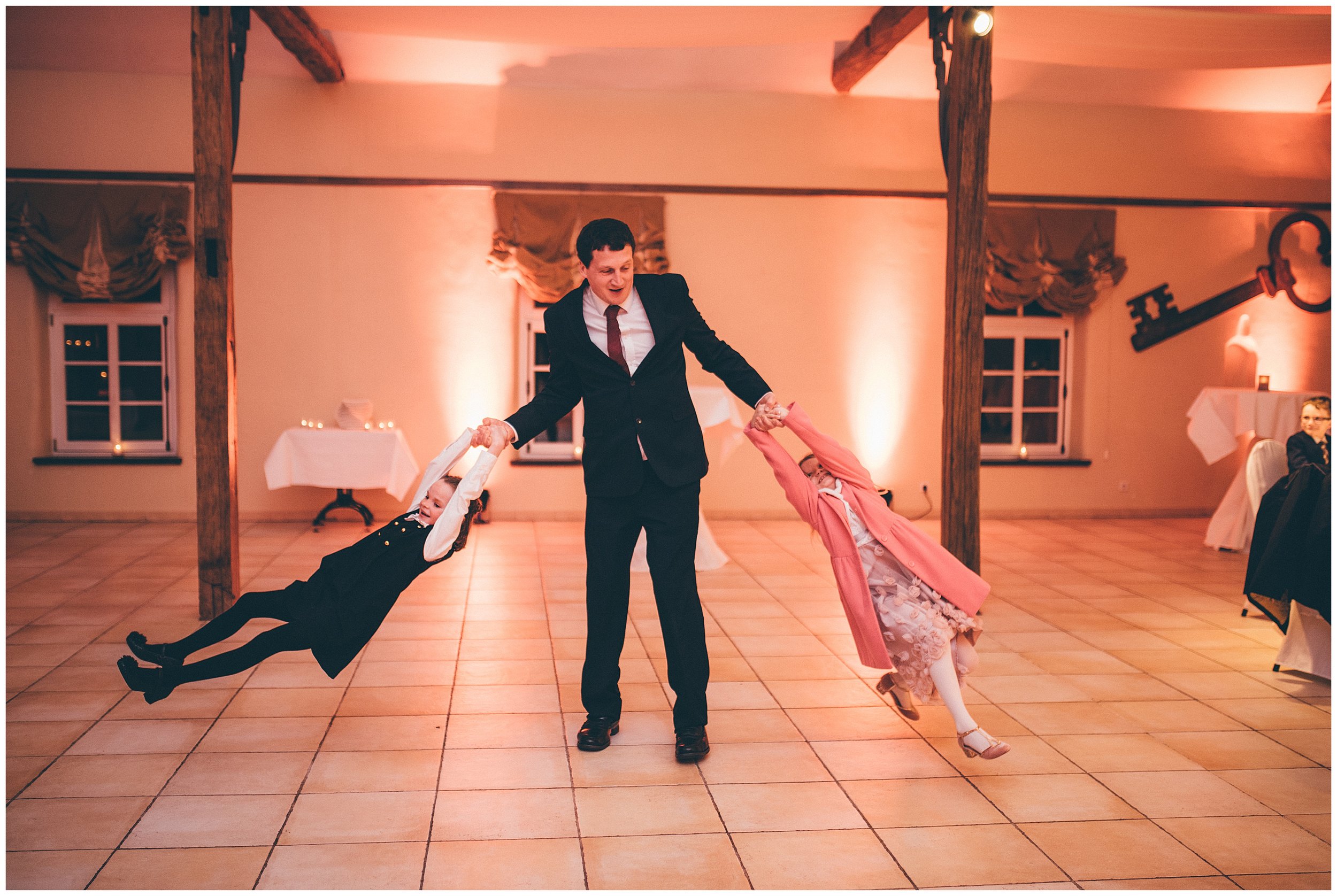 Wedding guest dances with his daughters in Luxembourg wedding