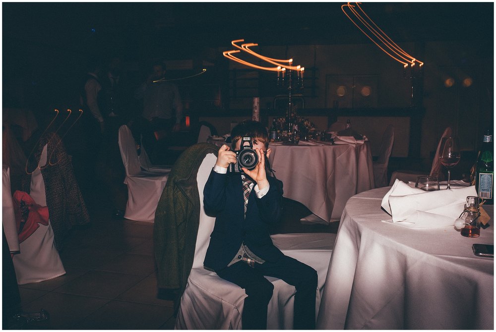 Little boy takes a photograph of the wedding photographer in Luxembourg