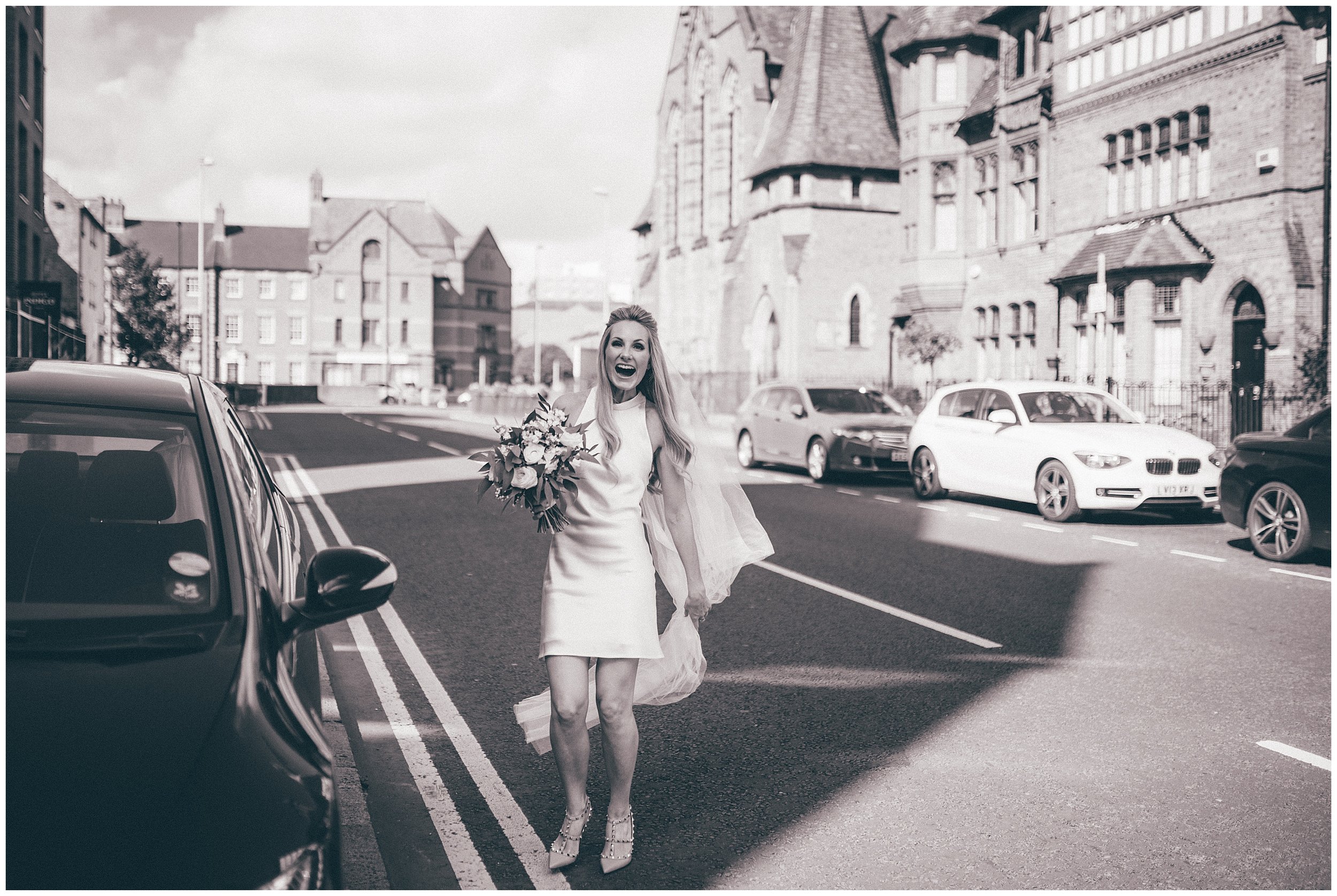 Bride arrives at her Chester city centre wedding in a mini silk wedding dress