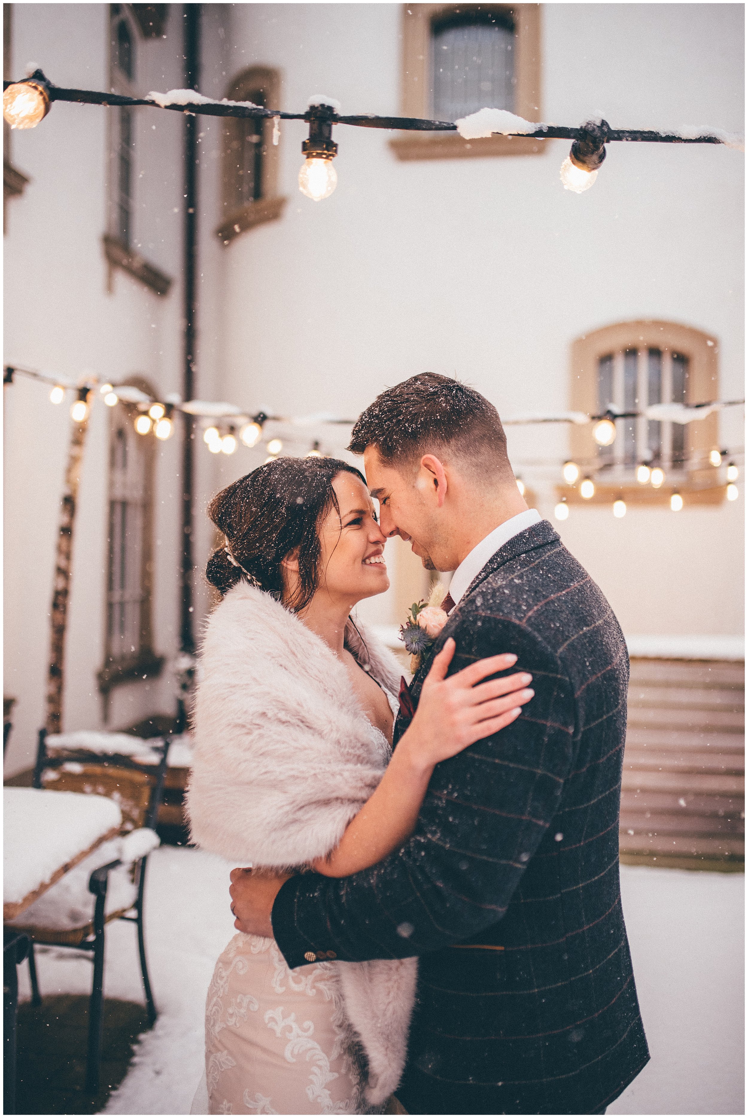 Bride and groom at their wedding in the snow at Luxembourg Chateau D'Urspelt