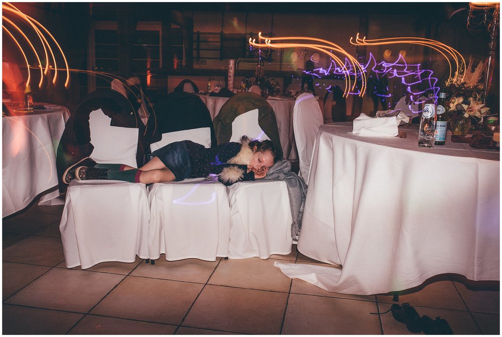 Little boy falls asleep during the wedding reception in Luxembourg destination wedding