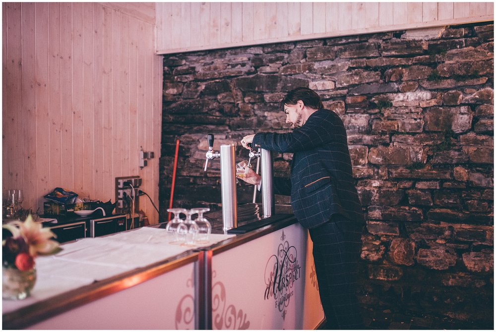 Wedding guest helps himself to a beer at Luxembourg wedding