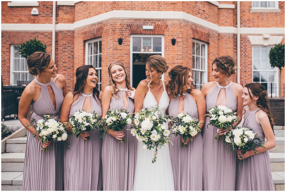 Bride and her bridesmaids laugh together at Chester wedding at the Old Palace