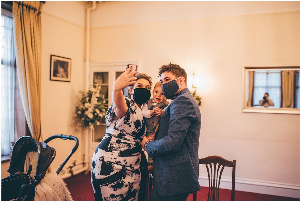 Family take a selfie at a covid mini wedding